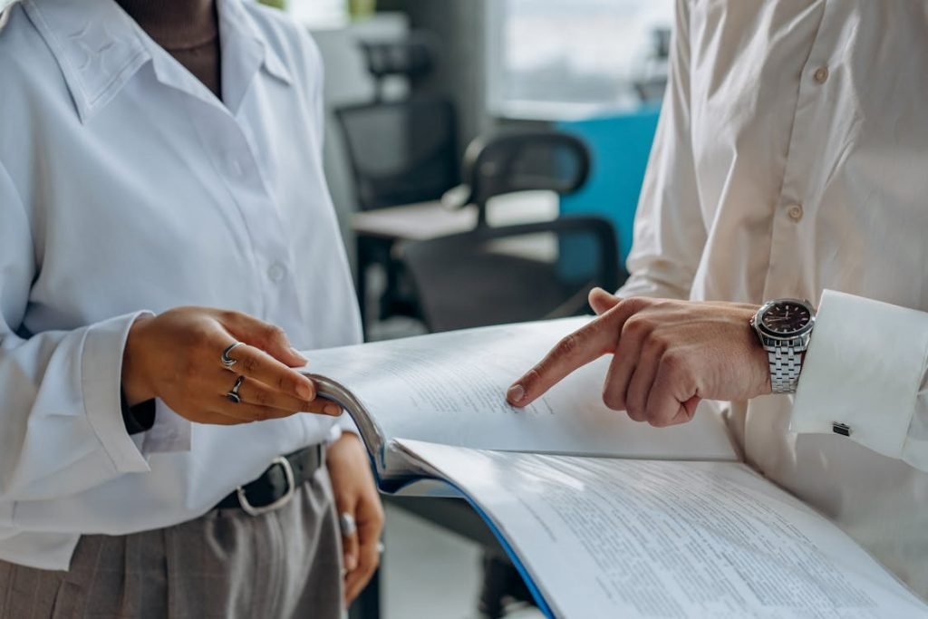 Two people holding a financial report 